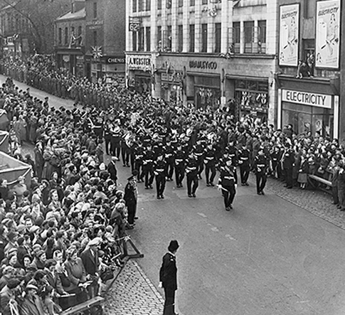 October 1954: The band of the Kings Own Light Infantry marches in Queen Street before the visit of the Queen and Prince Philip