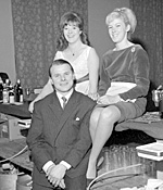 The landlord of the Fountain Inn, Morley, and two of his barmaids at a function at Morley Town Hall.